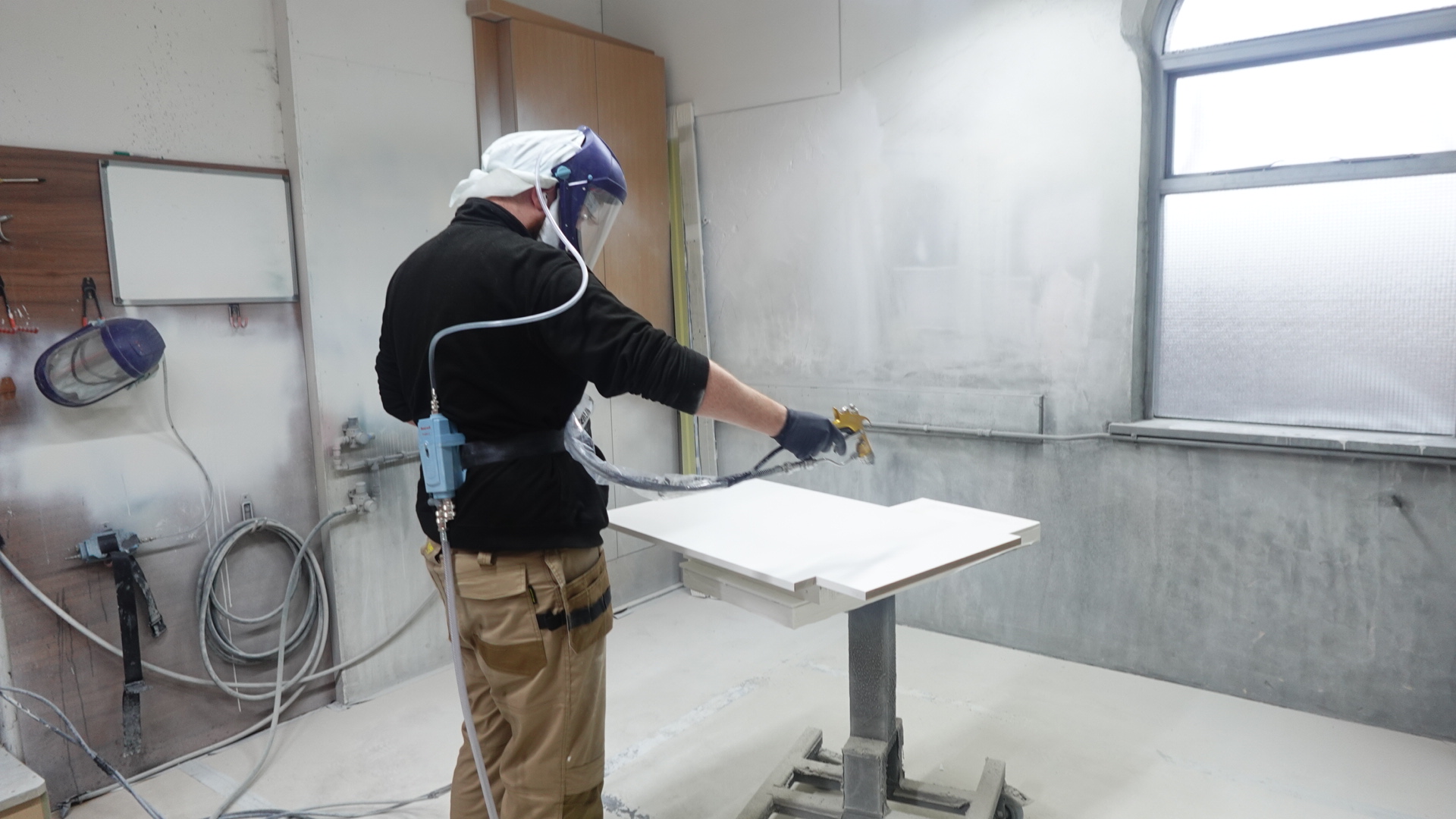 A tradesman working on a David Lisle luxury kitchen for a client in Wilmslow