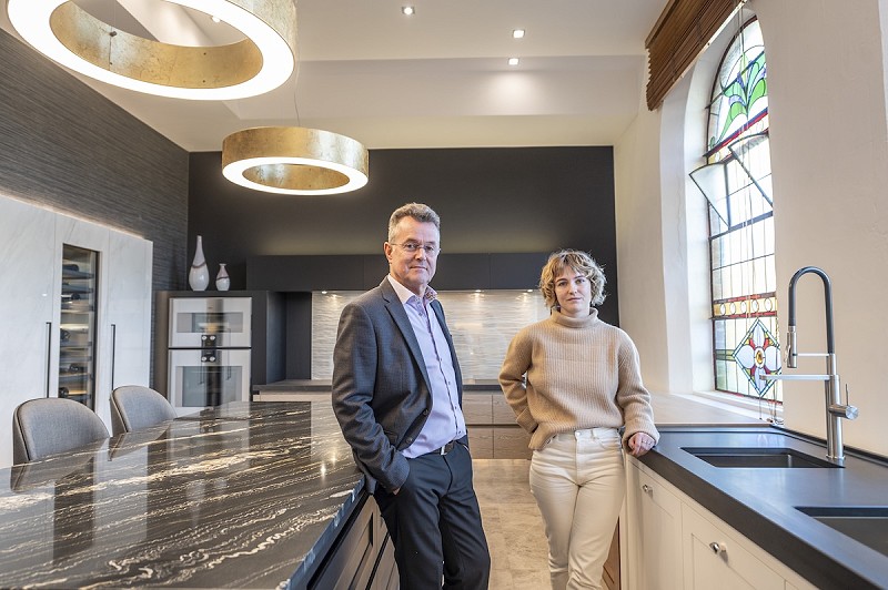 David Lisle and Becky Lisle stood inside their showroom in Macclesfield