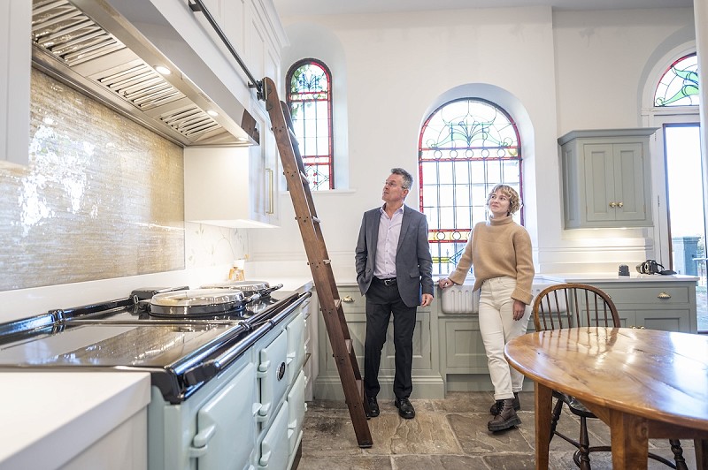 David Lisle and Becky Lisle stood inside their showroom in Macclesfield